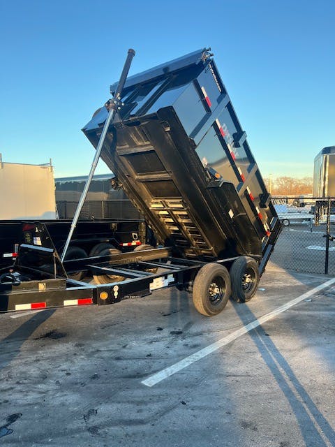 Fully extended hydraulic dumpster trailer